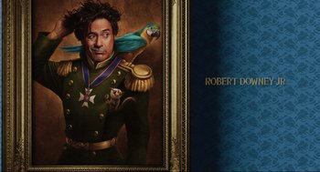 Movie still from “Dolittle” (2020), directed by Stephen Gaghan – A painting of a man with a parrot on his shoulder; Medium shot, Overhead angle