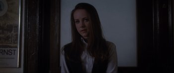 Movie still from “Donnie Darko” (2001), directed by Richard Kelly – A woman with long brown hair wearing a white shirt; Close Up shot, Over the shoulder angle