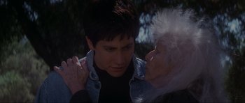 Movie still from “Donnie Darko” (2001), directed by Richard Kelly – An older woman and a young man are looking at each other; Close Up shot, Over the shoulder angle