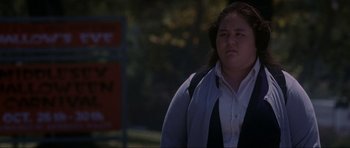 Movie still from “Donnie Darko” (2001), directed by Richard Kelly – A woman in a white shirt and a black jacket; Medium shot, Low angle