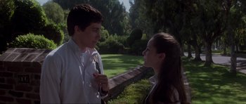 Movie still from “Donnie Darko” (2001), directed by Richard Kelly – A man and a woman talking to each other outside; Medium shot, Low angle