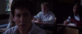 Movie still from “Donnie Darko” (2001), directed by Richard Kelly – Two young men sitting at a desk in a room; Close Up shot, Over the shoulder angle