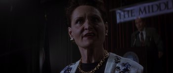 Movie still from “Donnie Darko” (2001), directed by Richard Kelly – An older woman wearing a gold chain necklace; Close Up shot, Low angle
