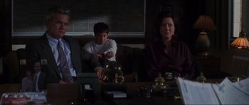 Movie still from “Donnie Darko” (2001), directed by Richard Kelly – A man and a woman sitting at a coffee table; Medium shot, Low angle