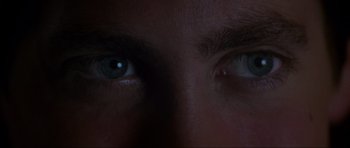 Movie still from “Donnie Darko” (2001), directed by Richard Kelly – A man's eyes in the dark; Extreme Close Up shot, Overhead angle
