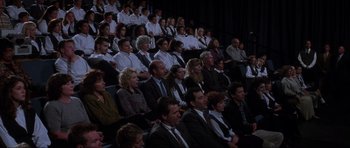 Movie still from “Donnie Darko” (2001), directed by Richard Kelly – A group of people sitting in a room; Wide shot, High angle