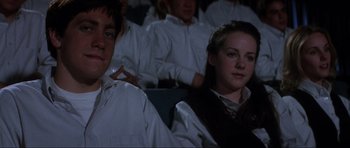 Movie still from “Donnie Darko” (2001), directed by Richard Kelly – A couple of people that are sitting in a room; Close Up shot, Low angle