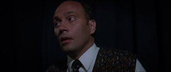 Movie still from “Donnie Darko” (2001), directed by Richard Kelly – A person wearing a suit and tie; Close Up shot, Low angle