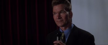 Movie still from “Donnie Darko” (2001), directed by Richard Kelly – A person wearing a suit and tie; Close Up shot, Low angle