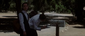 Movie still from “Donnie Darko” (2001), directed by Richard Kelly – A man and a woman standing next to each other; Medium shot, Low angle