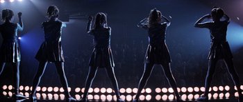 Movie still from “Donnie Darko” (2001), directed by Richard Kelly – A couple of people that are on a stage; Wide shot, Low angle