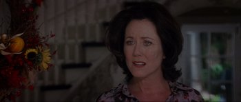 Movie still from “Donnie Darko” (2001), directed by Richard Kelly – A person wearing a dress; Close Up shot, Low angle