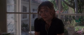 Movie still from “Donnie Darko” (2001), directed by Richard Kelly – A person sitting in front of a window; Close Up shot, Over the shoulder angle