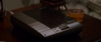 Movie still from “Donnie Darko” (2001), directed by Richard Kelly – An old video game console sitting on top of a table; Extreme Close Up shot, High angle