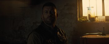 Movie still from “Don't Breathe 2” (2021), directed by Rodo Sayagues – A person in a dark room; Close Up shot, Low angle