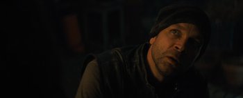 Movie still from “Don't Breathe 2” (2021), directed by Rodo Sayagues – A person wearing a hat and a jacket; Close Up shot, High angle