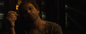 Movie still from “Don't Breathe 2” (2021), directed by Rodo Sayagues – A person wearing a shirt; Close Up shot, Low angle