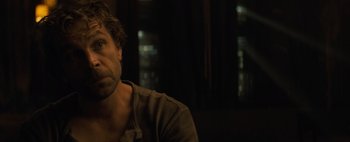 Movie still from “Don't Breathe 2” (2021), directed by Rodo Sayagues – A person sitting in front of a window; Close Up shot, Over the shoulder angle