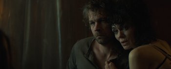 Movie still from “Don't Breathe 2” (2021), directed by Rodo Sayagues – A man and a woman looking at the camera; Close Up shot, High angle