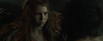 Movie still from “Don't Breathe 2” (2021), directed by Rodo Sayagues – A young girl with long brown hair looking at the camera; Close Up shot, Over the shoulder angle