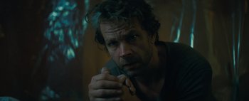 Movie still from “Don't Breathe 2” (2021), directed by Rodo Sayagues – A person holding his hands together; Close Up shot, High angle