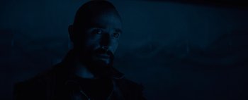 Movie still from “Don't Breathe 2” (2021), directed by Rodo Sayagues – A man with a goatee is looking at the camera; Close Up shot, Low angle