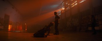 Movie still from “Don't Breathe 2” (2021), directed by Rodo Sayagues – A man and a woman are standing in the dark; Wide shot, Low angle