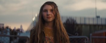 Movie still from “Don't Breathe 2” (2021), directed by Rodo Sayagues – A young girl with long hair is looking at the camera; Close Up shot, Low angle