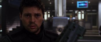 Movie still from “Doom” (2005), directed by Andrzej Bartkowiak – A person wearing a headset; Close Up shot, Over the shoulder angle