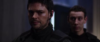 Movie still from “Doom” (2005), directed by Andrzej Bartkowiak – A person wearing a headset; Close Up shot, Over the shoulder angle