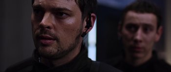 Movie still from “Doom” (2005), directed by Andrzej Bartkowiak – A person wearing a headset; Close Up shot, Over the shoulder angle