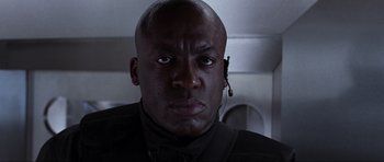 Movie still from “Doom” (2005), directed by Andrzej Bartkowiak – A person wearing a headset; Close Up shot, Low angle