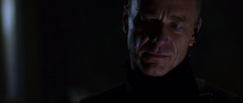 Movie still from “Doom” (2005), directed by Andrzej Bartkowiak – A person in a dark room; Close Up shot, Low angle