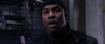 Movie still from “Doom” (2005), directed by Andrzej Bartkowiak – A person wearing a hat; Close Up shot, Low angle