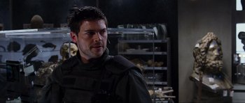 Movie still from “Doom” (2005), directed by Andrzej Bartkowiak – A person wearing a uniform; Close Up shot, Over the shoulder angle