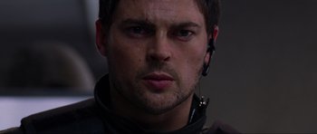 Movie still from “Doom” (2005), directed by Andrzej Bartkowiak – A person wearing a headset; Close Up shot, Low angle