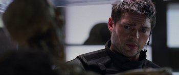 Movie still from “Doom” (2005), directed by Andrzej Bartkowiak – A person wearing a black jacket; Close Up shot, Over the shoulder angle