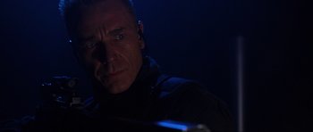 Movie still from “Doom” (2005), directed by Andrzej Bartkowiak – A person in a dark room; Close Up shot, Low angle