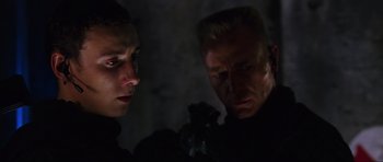 Movie still from “Doom” (2005), directed by Andrzej Bartkowiak – A man and a woman looking at one another; Close Up shot, Low angle