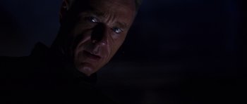 Movie still from “Doom” (2005), directed by Andrzej Bartkowiak – A person looking at the camera; Close Up shot, Low angle
