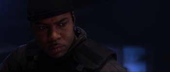 Movie still from “Doom” (2005), directed by Andrzej Bartkowiak – A person wearing a hat; Close Up shot, Low angle