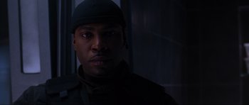 Movie still from “Doom” (2005), directed by Andrzej Bartkowiak – A person wearing a hat; Close Up shot, Low angle