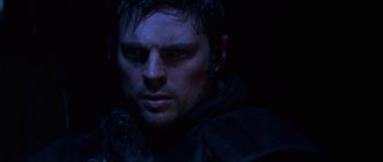 Movie still from “Doom” (2005), directed by Andrzej Bartkowiak – A person wearing a black jacket; Close Up shot, Over the shoulder angle