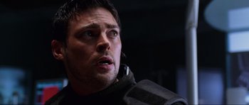 Movie still from “Doom” (2005), directed by Andrzej Bartkowiak – A person wearing a jacket; Close Up shot, Low angle