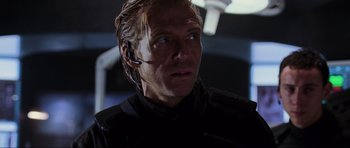 Movie still from “Doom” (2005), directed by Andrzej Bartkowiak – A person wearing headphones; Close Up shot, Low angle