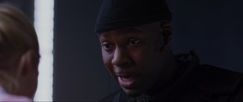 Movie still from “Doom” (2005), directed by Andrzej Bartkowiak – A person wearing a hat; Close Up shot, Low angle