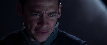 Movie still from “Doom” (2005), directed by Andrzej Bartkowiak – A man's face in the dark; Close Up shot, Low angle