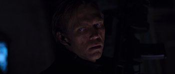 Movie still from “Doom” (2005), directed by Andrzej Bartkowiak – A person wearing a black shirt; Close Up shot, Low angle