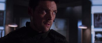 Movie still from “Doom” (2005), directed by Andrzej Bartkowiak – A person wearing a black jacket; Close Up shot, Low angle