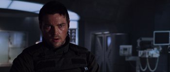 Movie still from “Doom” (2005), directed by Andrzej Bartkowiak – A person wearing a jacket; Close Up shot, Over the shoulder angle